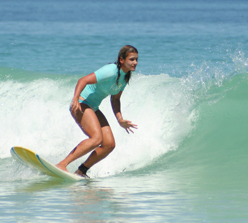 Girl surfing at Scarborough Beach